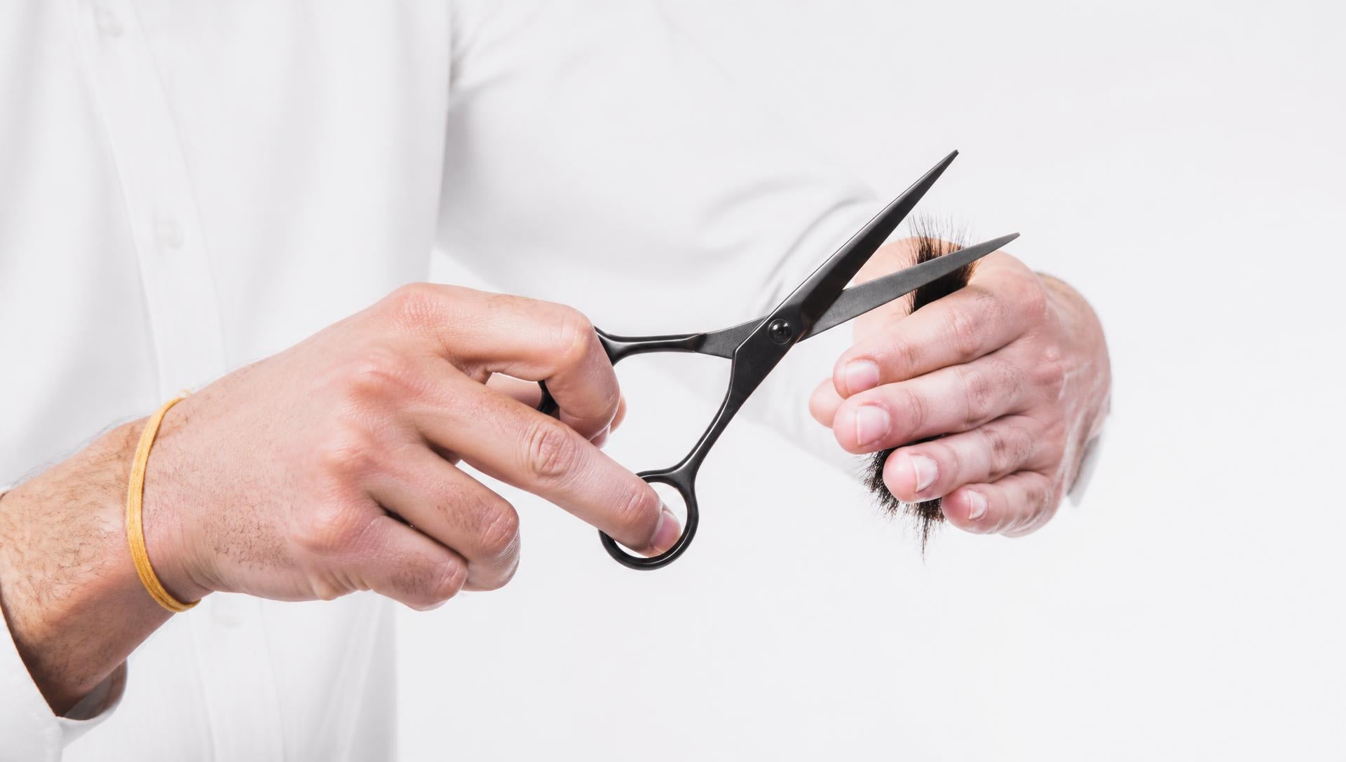 Barber cutting with shears